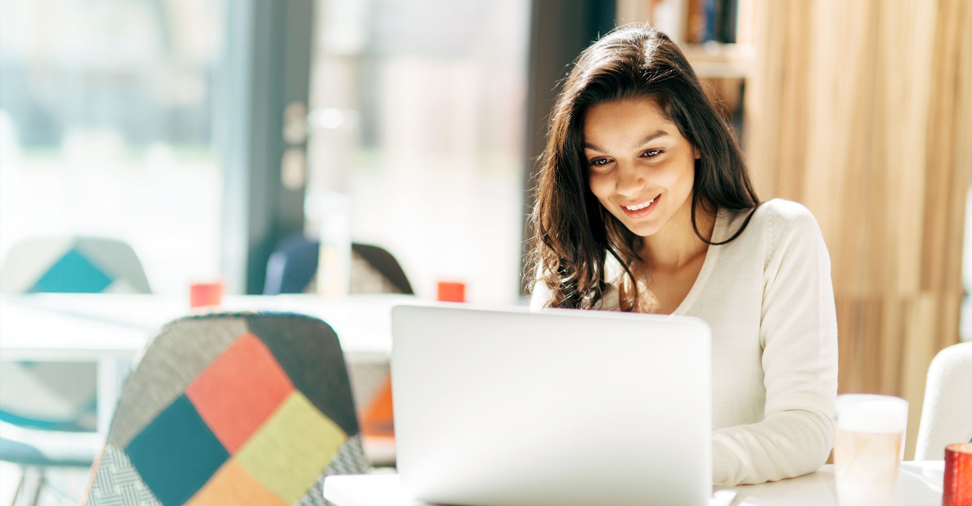 Woman on a computer checking out designs